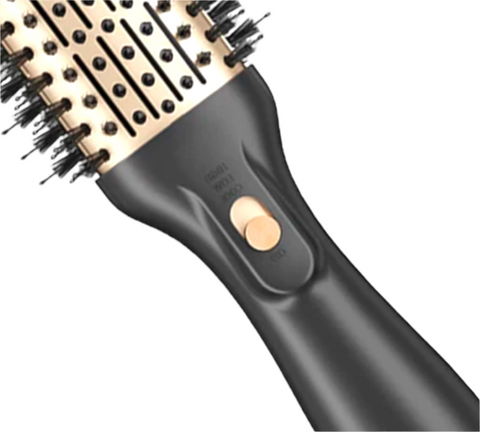 An electric volumizing brush with a black and gold design, featuring a round brush head with bristles for styling.